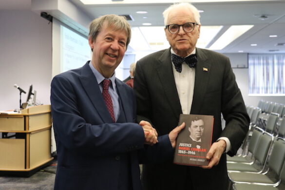 Dr. Doorley shaking hands with Judge Peter Fox Cohalan.