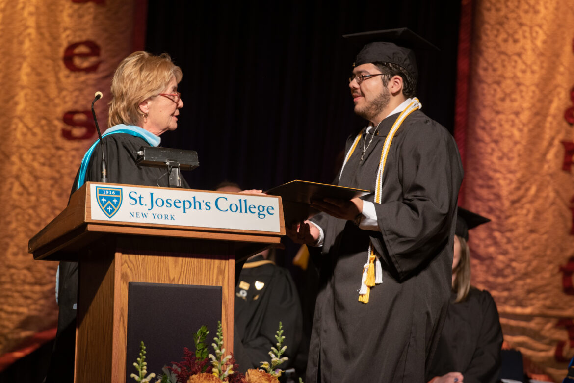 Scholarship recipient accepts award.