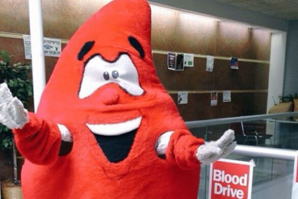 A person wearing a blood drop costume at one of SJC Long Island's blood drives.