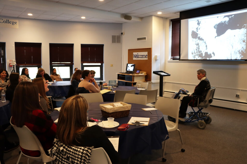 Faculty and staff listening to Yindra's presentation.