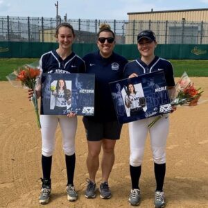 Softball players smiling.