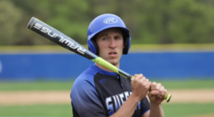 Baseball player holding a bat.