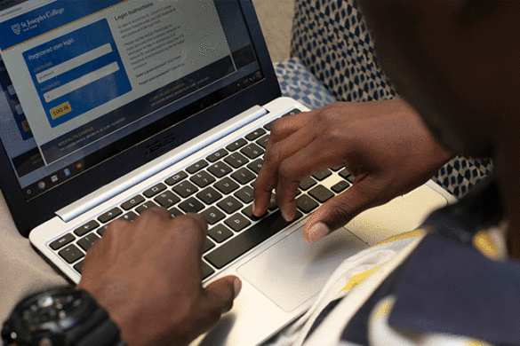 Student working on their laptop.