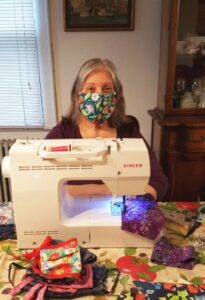 Woman sewing a mask.