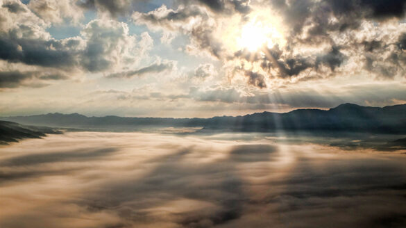 A picture of the sun setting through the clouds to remind students of the "Instruments of Hope."