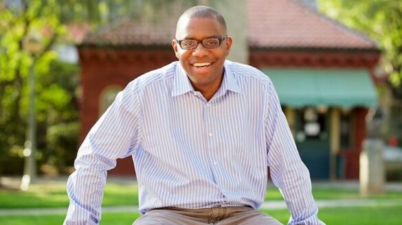 Man sitting and smiling.