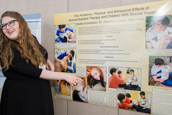 Student presenting her research at the College's annual symposium.