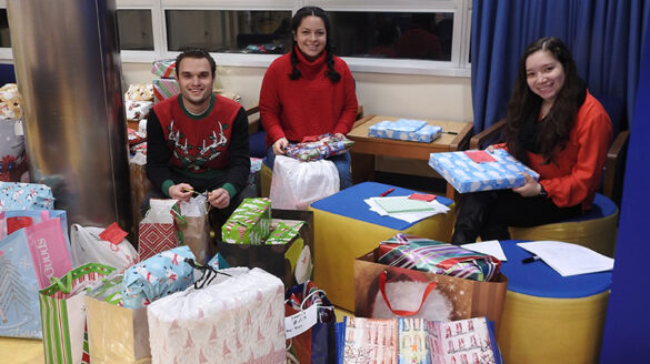 Christmas Gift Drive presents being wrapped, 2018.