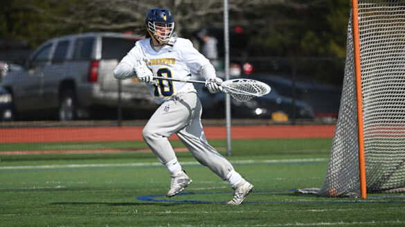 Andrew Brust playing lacrosse.