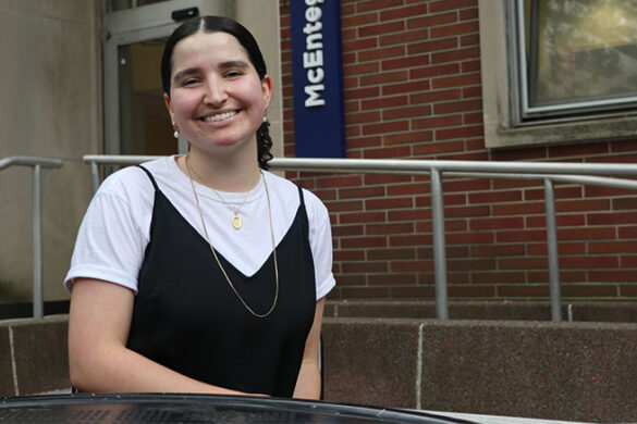 Woman seated and smiling
