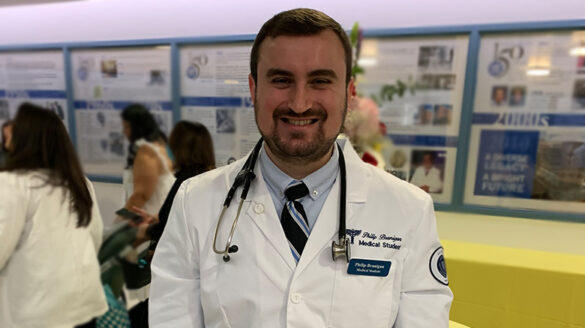 Philip Branigan ’16 at his white coat ceremony.