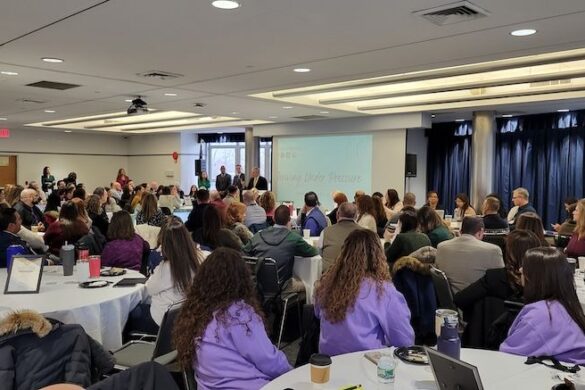 Crowded room of educators.